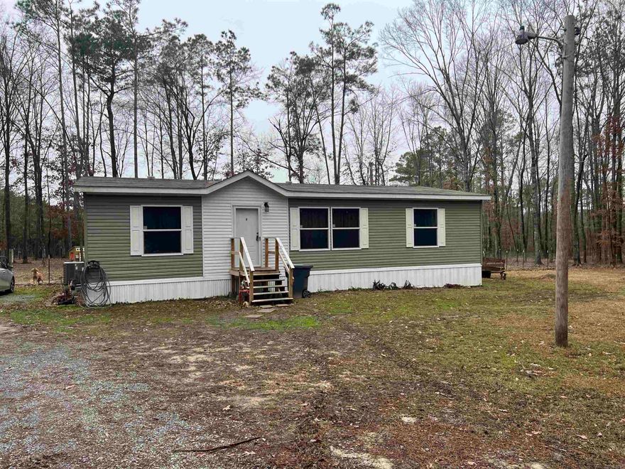 Extremely well maintained three bed two bath mobile on sitting on 2.26 acres with a  fenced in back yard.  The home has an open concept floor plan, large master suite with whirlpool tub, two additional nice size bedrooms perfect for a guest room, office or growing family, spacious closets and a separate laundry room.  Schedule your showing today!