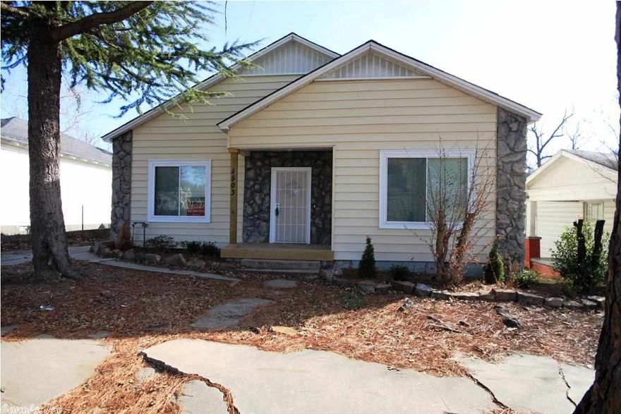 This is a remodeled 1930's home. The home still has a 1930's charm with archways and rounded walls. It has a new kitchen with granite counter tops and black appliances. The pantry has a light that turns on and off when the door opens and closes. The home feels huge with its 10 feet ceilings. It has a great open flow to it.  The back of the home has a drive up alley entrance and front parking pad. This would be an awesome home for medical staff that needs to be close to hospital.