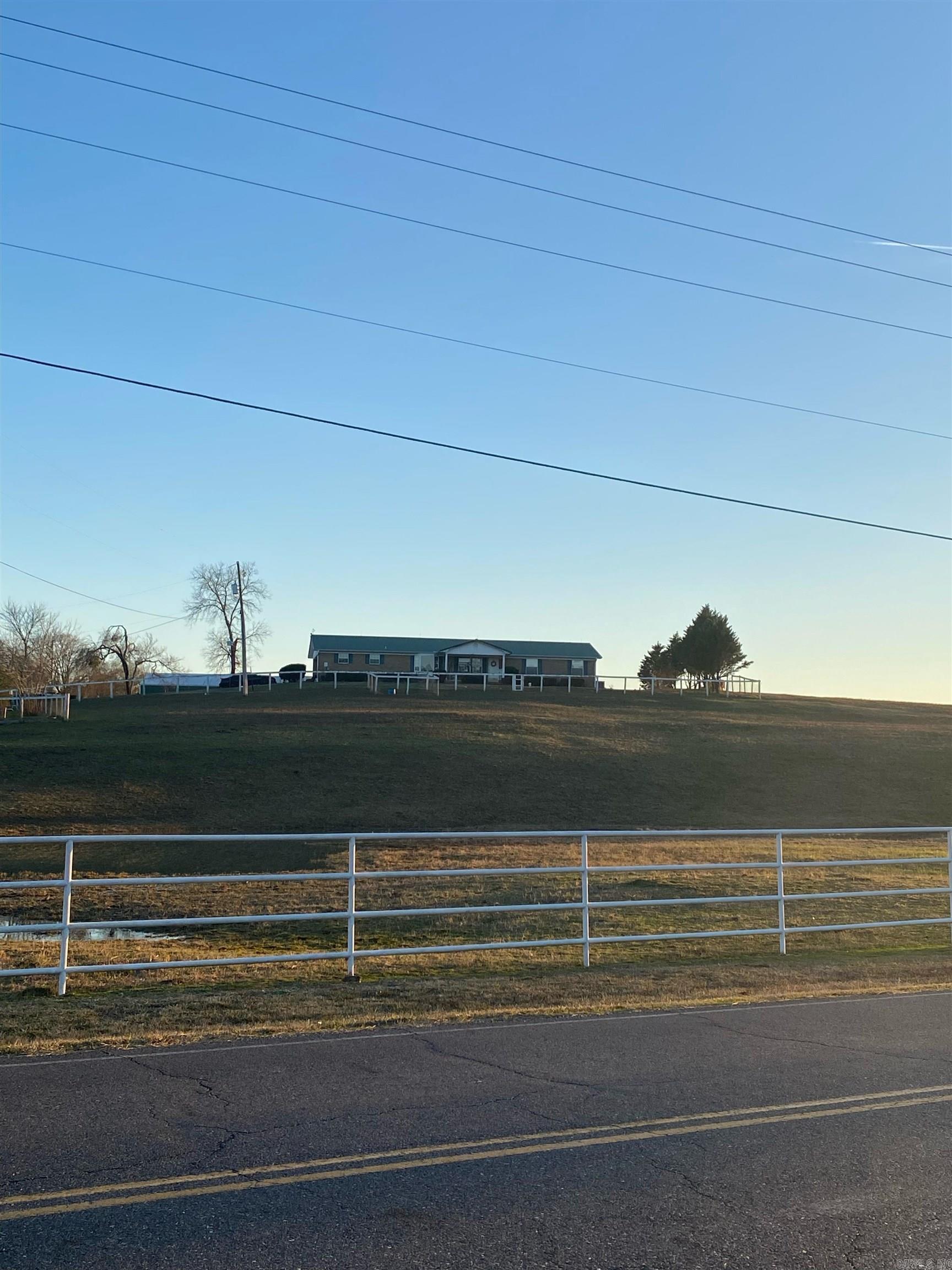 Gorgeous equestrian property! Income producing thoroughbred training center nestled on 137.36 acres with four bars, 106 stalls, 5/8 mile tract, covered an uncovered, electric horse walkers, several wash, bays, and turnouts. As an added bonus there are two homes on site.