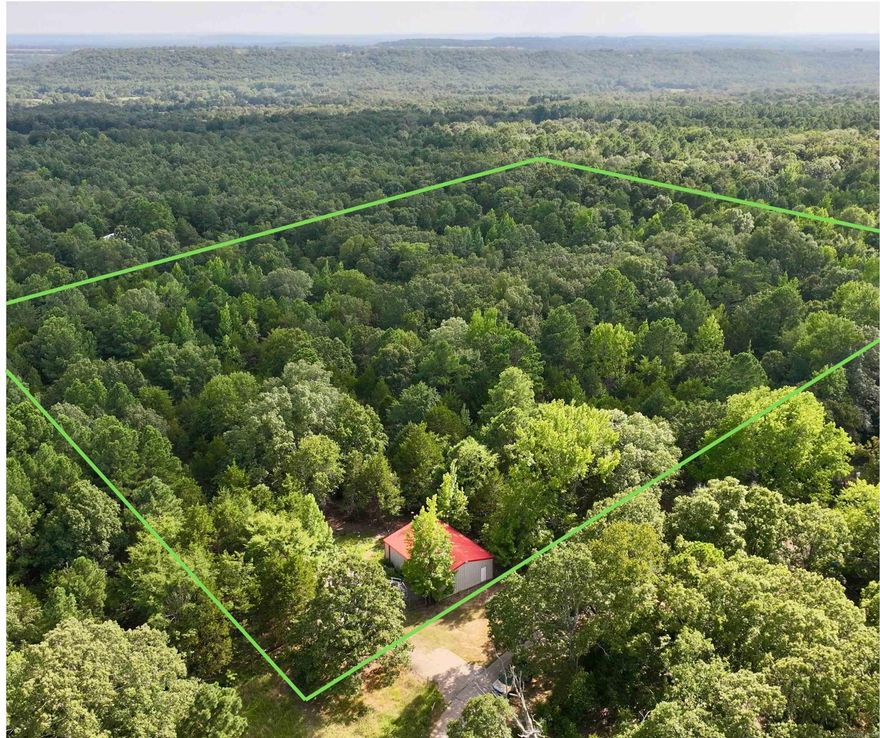 Ultra private acreage with a red iron metal building now available!  Turn this property into your new homestead or utilize the existing building for your business! All utilities available at Ash Dr.