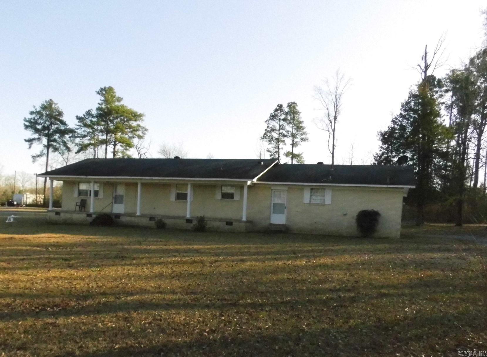 **Brick home sitting on 1 acre in the EAST END community**Side loading double carport**Original hardwood floors in bedrooms and hallway**Updated wood floors in the large open living/dining area**Good bones in this home, just waiting for someone ready to update and make it your own**Previous owner had a barber shop with separate entrance and its own bath**Would be great for having your own in-house office/business**