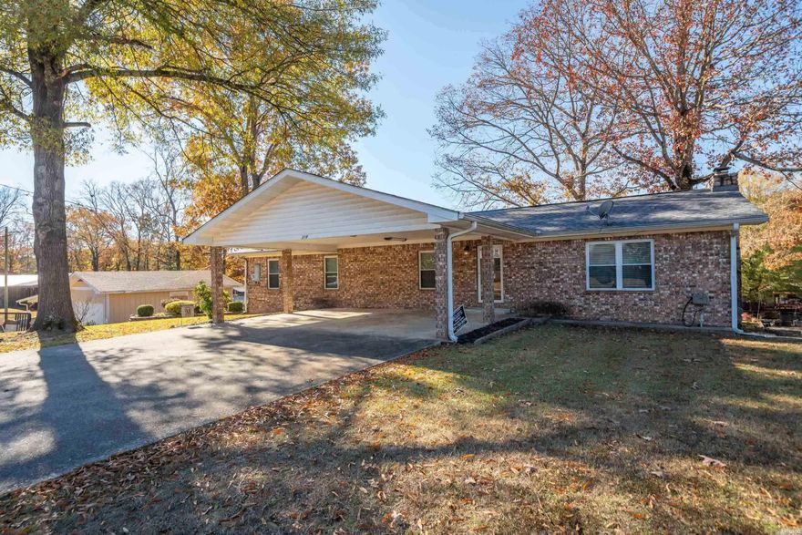 Fantastic price on this 5 bedroom, 3 bath home on Lake Hamilton with approximately 100' of lake frontage.  This home has been fully updated and is currently being used as a short term rental.  The home sleeps up to 16 guests and is being sold fully furnished, with all contents conveying to the new buyer.   Brand new roof was installed in 2024.  The property has an expansive outdoor deck overlooking the lake, along with a single stall covered boat slip. This lake property would be particularly ideal for large family or someone looking to add to their rental portfolio.
