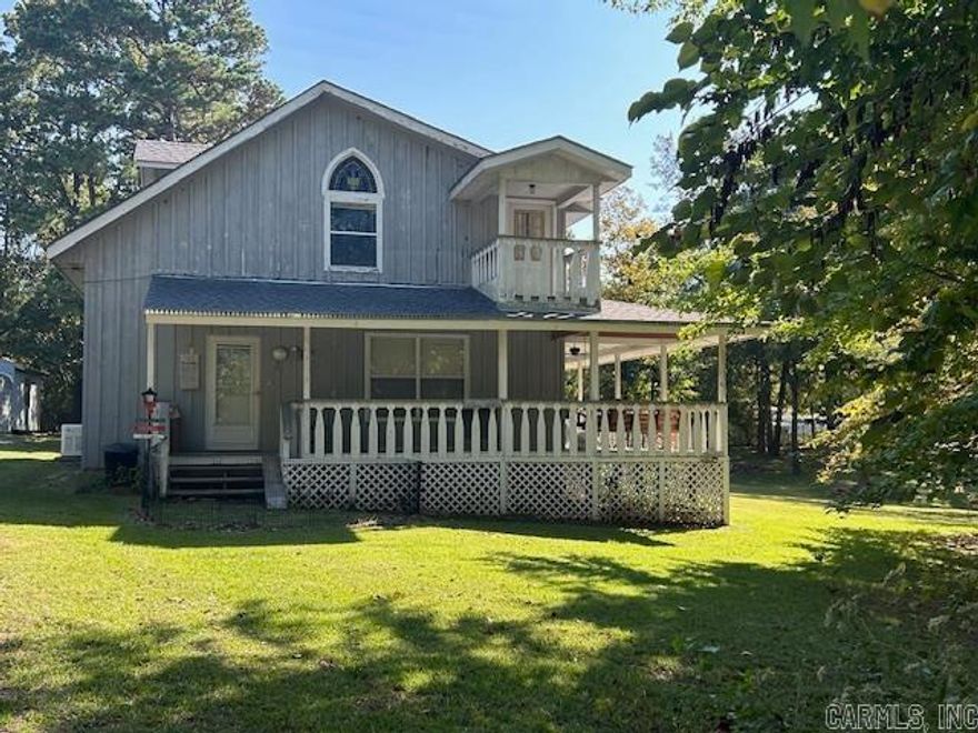 No. 02409 Charming 2-story, 3-bedroom, 2-bath home with 1,594 sq ft of living space, nestled on a large 0.84-acre lot with dual street frontage. Located on a peaceful, tree-lined street in town, this home offers modern comfort with central HVAC, a Generac generator, and a new roof. Features include a detached single carport, a double carport with storage, and inviting wrap-around porches on three sides. Inside, you'll find beautiful pine plank flooring, a spacious loft with a sitting area, and balcony access. Kitchen appliances are included. Enjoy quiet living with in-town convenience. Priced at $210,000.