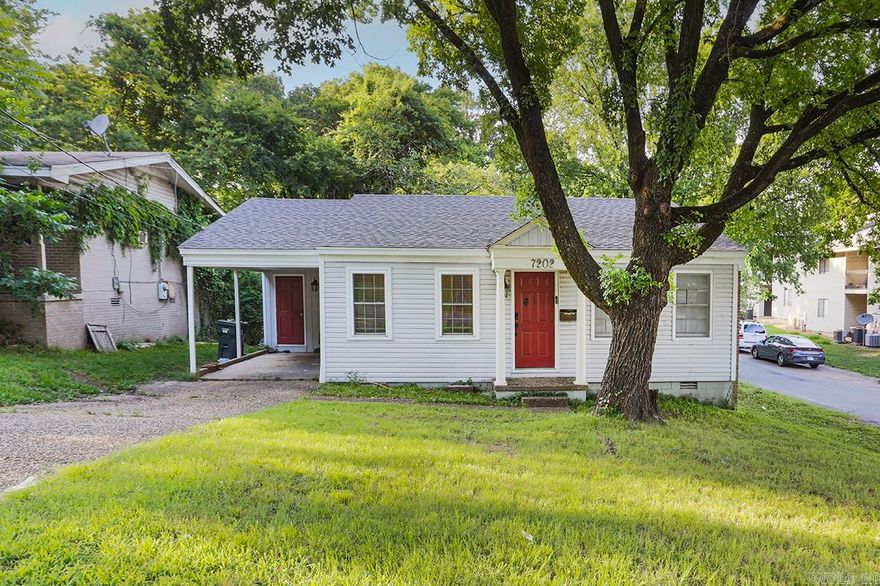 Cute, cute, cute!  Fantastic home in midtown with large shade trees on corner lot!  Beautiful, updated 3 bedroom, 2 full bath home has just been painted & had new luxury vinyl tile flooring installed.  Nice kitchen, separate laundry, pantry, 2 gorgeous baths including main with walk-in shower!  Wood privacy fenced back yard.  Carport with storage room.  Centrally located and unbeatable price!