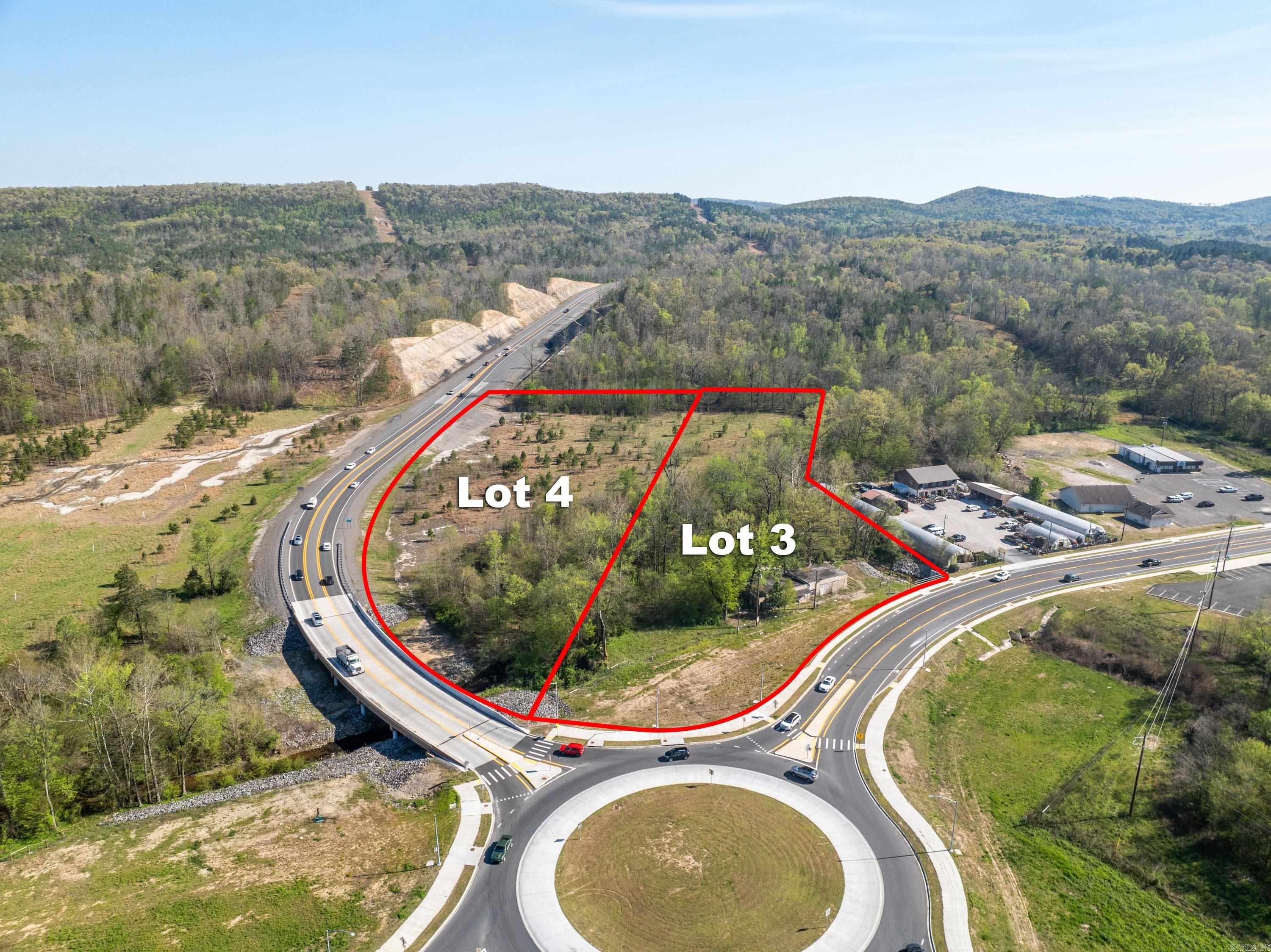 Two parcels totaling a combined 4.03 acres located at the entrance to the new MLK Expressway/Highway 5 Bypass. Excellent commercial opportunity with 275 feet of Park Avenue frontage and 910 feet of bypass visibility. Cement building located on property has no value. Value in the land only. Do not enter building.