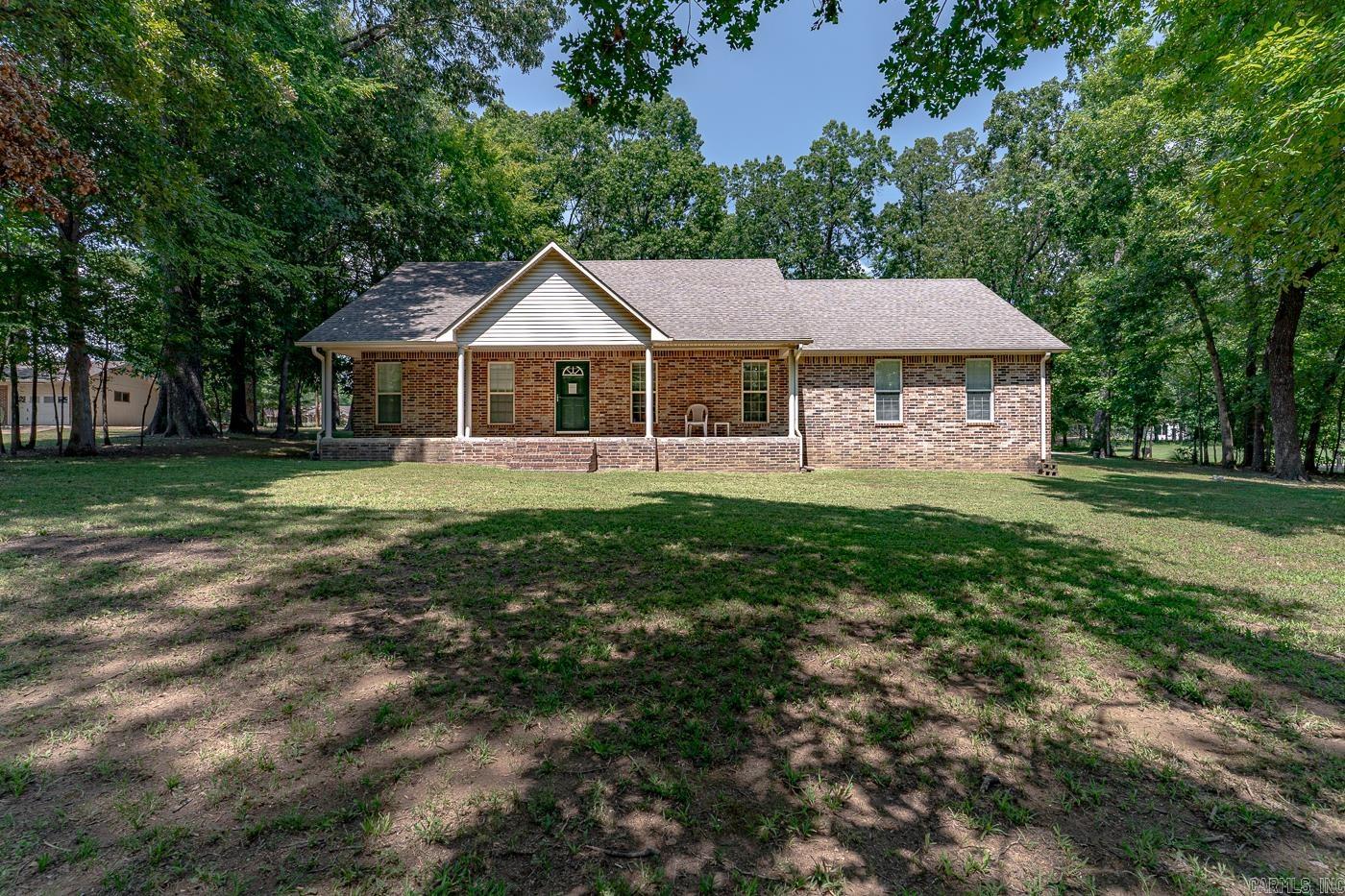 Welcome to Market 2901 Dacus Ln of the Ron-Robson Dacus Sub. in Jonesboro, AR within the Jonesboro School District. Situated on a 1.38 acre corner lot sprinkled w/ mature shade trees is a 2008 built Ranch Rambler wrapped in brick & vinyl, topped w/ architectural shingles, and accented by a covered front porch, fenced back patio, rear entry garage, and guttering. The interior features 2,310 sf of well laid out living space over a split floor plan and contains: an eat-in kitchen w/ island w/ bar seating, pantry, and ample cabinet & countertop space, large living room, Master w/ en-suite w/ vanity, walk-in closet & walk-in shower, 2 spare bedrooms w/ Jack-n-Jill bathroom w/ shower/tub combo, half bath, and laundry room. You'll love the 1,200 sf wired & floored shop w/ overhead door, exterior lighting, and plumbed for water & gas. Seller improvements include: HVAC, oven, wired for cable, surround sound in living room, security for entry and glass breakage, LED lighting, and video cameras. Conveniently located within six miles of: ASU, NEA Baptist Hospital, and favorite local retail & dining establishments. Call today to schedule your tour and make this well maintained house your home.