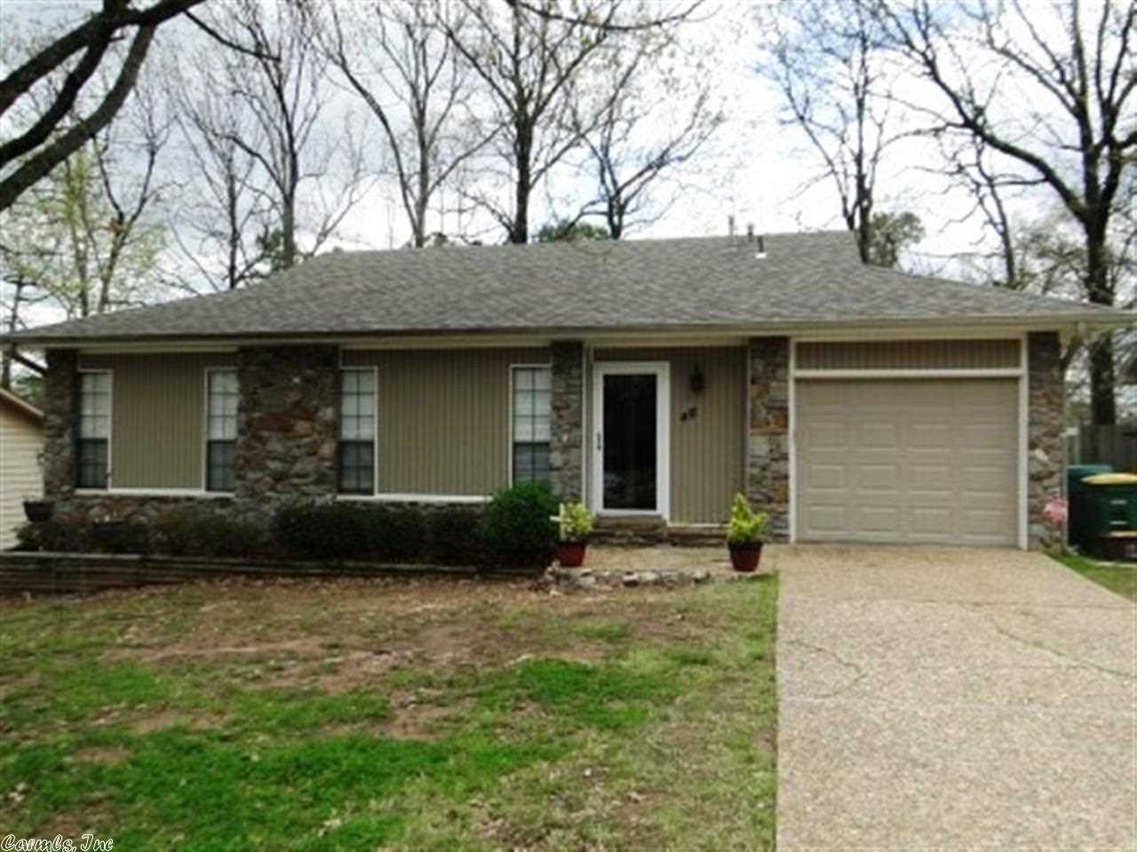 Awesome move in ready home in great W. Little Rock location. close to shopping and restaurants. The home has a spacious open living area with vaulted ceiling & gas log fireplace. It has nice tile flooring through out the living , kitchen and master bedroom. The eat in kitchen offers stainless steel & black appliances including: built-in microwave, smooth surface range, dishwasher. You can relax on the covered deck with finished ceiling & ceiling fan. Large fenced backyard. Ck out the garage.
