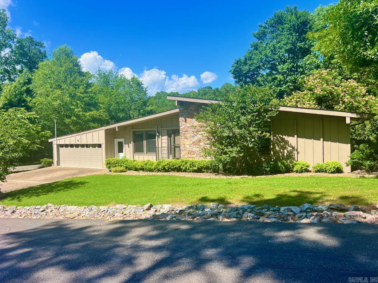 Must See! This mid century gem is located in the beautiful Sonora neighborhood around the DeSoto Golf Course. This spacious three bedroom, two bath features an enclosed garage, 7 x 17 shop in the garage, covered deck, two living areas, separate inside laundry room and three good sized bedrooms. No carpet and move in ready. Agents check comments.