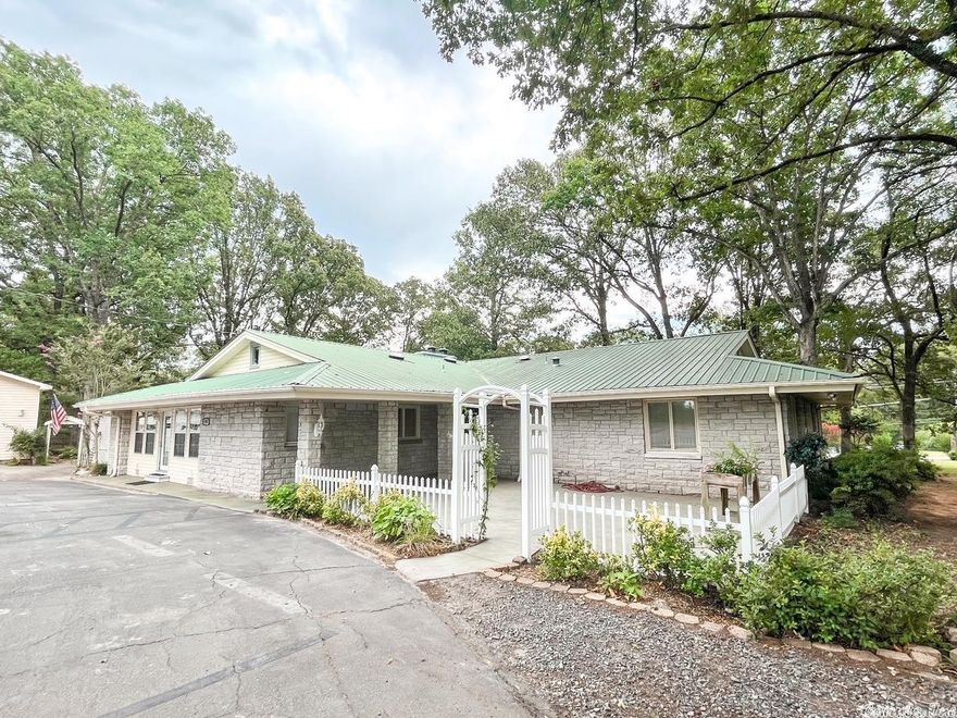 Come see this beautiful, well-built custom home with versatile space sitting on 2 private acres right in the city limits! This home features two living rooms, a spacious dining room, 3rd LR that has been used as a Master with a half bath, a screened-in deck, large patio, gas fireplaces, crown molding, large windows letting in so much light, tons of built-ins, Kenmore elite double oven, large utility room and spacious bedrooms! There is also a great 24x32 shop/garage. Many updates! Agents see remarks.