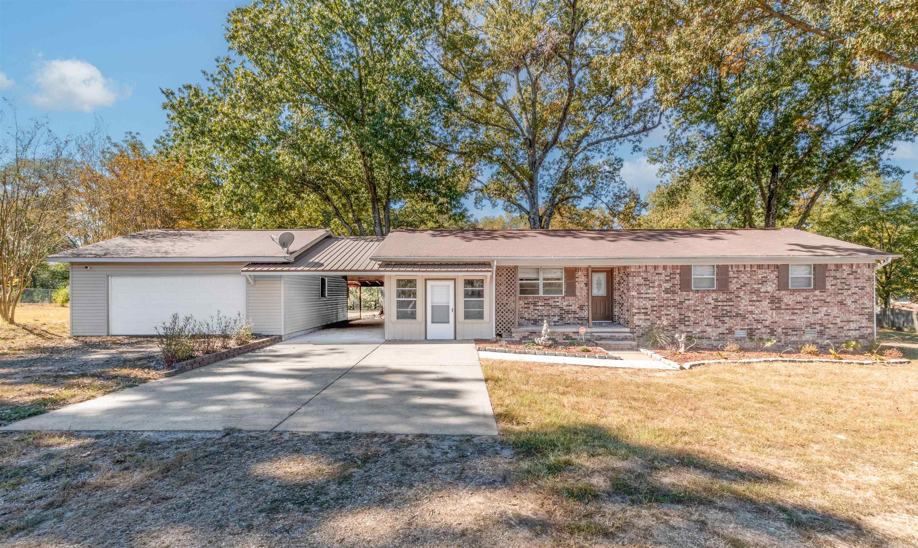 Looking for acreage close to the city? This updated one-level home on 2.46 acres is the perfect find! Featuring 3 bedrooms, this home boasts new carpet, newer laminate flooring, fresh paint, updated lighting, and hardware. The kitchen and bathrooms have been recently renovated, giving the home a modern feel. An added bonus room offers great flexibility as a den or playroom. The two-car garage is attached via a covered breezeway for convenience. The property is fully fenced and includes a shed and an exterior building that convey. Plus, an active American Home Shield warranty is in place and will transfer to the new owner expires end of August 2025. While the home is being sold “as is,” the numerous updates and warranty provide peace of mind. This property combines the best of country living with easy access to city conveniences! Exterior building has electricity. Agents see remarks!