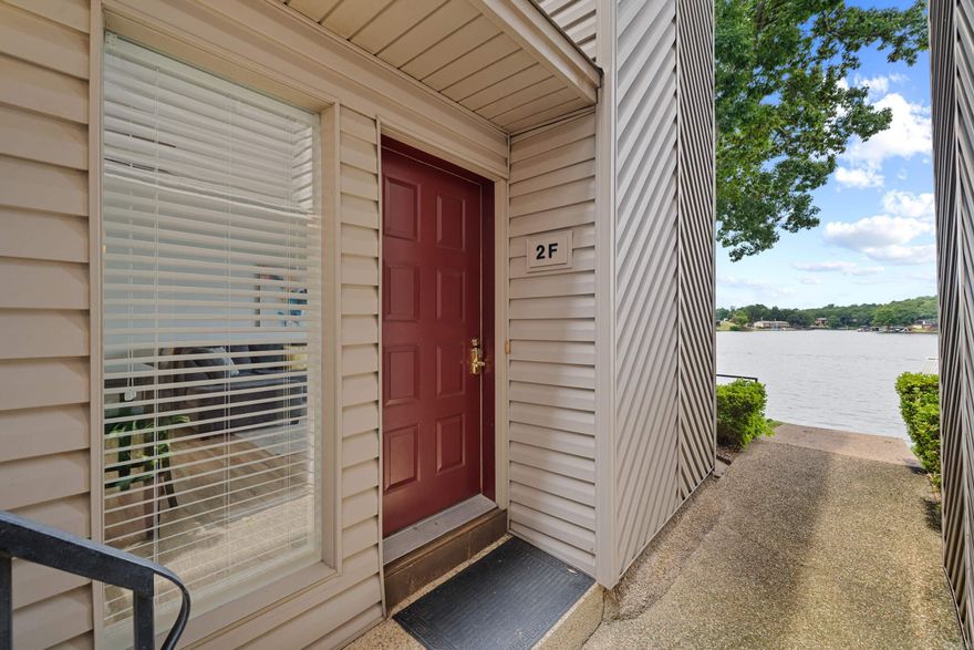 Gorgeous ground level 2 bedroom condo with NEW FLOORING and a COVERED DOCK on the MAIN CHANNEL! Enjoy the grassy area just off the patio steps away from the covered dock,  swim platform and pool. Turn key condo is selling fully furnished. This is an active nightly rental. Quick access to Oaklawn and downtown Hot Springs makes this the ideal location for year round bookings!  see https://www.youtube.com/watch?v=B0oN5Z7D72M for video tour