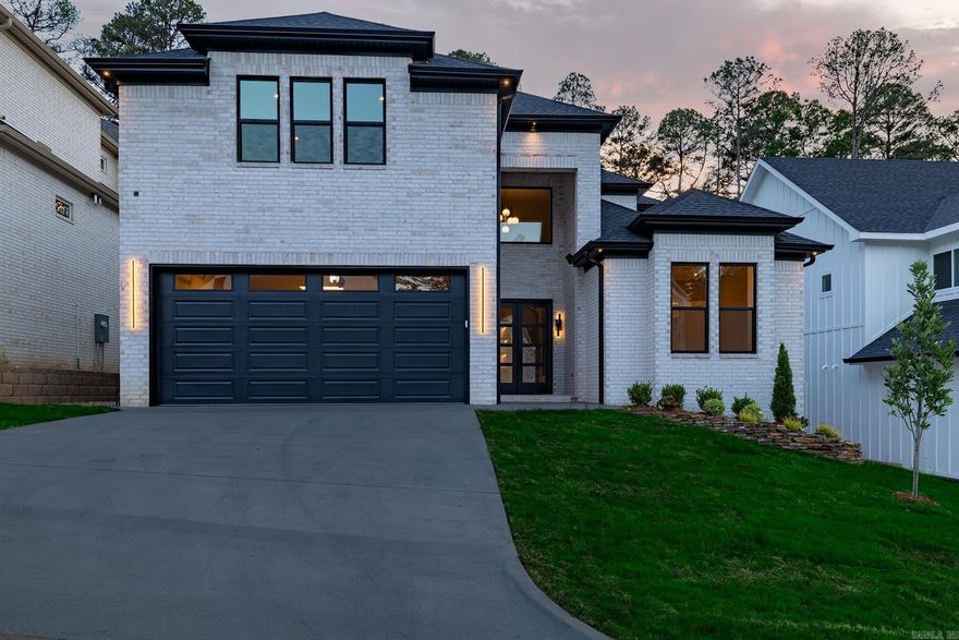 Experience the pinnacle of luxury and thoughtful design in this stunning new construction located in the heart of West Little Rock. This expansive floor plan features 4 dedicated bedrooms plus a versatile 5th room—perfect as a home office or guest suite—alongside 4.5 bathrooms. Stepping inside, you are greeted by gorgeous 1/2" engineered hardwood floors that flow seamlessly through an open-concept living space. The gourmet kitchen is a showstopper, boasting custom cabinetry, quartz countertops, and a genius "Costco Door" for effortless grocery transfers directly from the garage to the pantry. This home is built for the future, featuring: EV Ready: A massive 100 AMP EV charger in the garage. Smart Security: Pre-wired for cameras and a garage door opener with integrated video. Precision Lighting: 4-inch LED 360-degree gimbal lights throughout for the perfect ambiance. The garage is fully insulated (including the door) and finished with a professional stain and seal. Step through the double-wide front entry or the massive sliding back door to find a porch that has been meticulously colored, stained, and sealed. With abundant storage and premium finishes. Schedule your showing today!!!