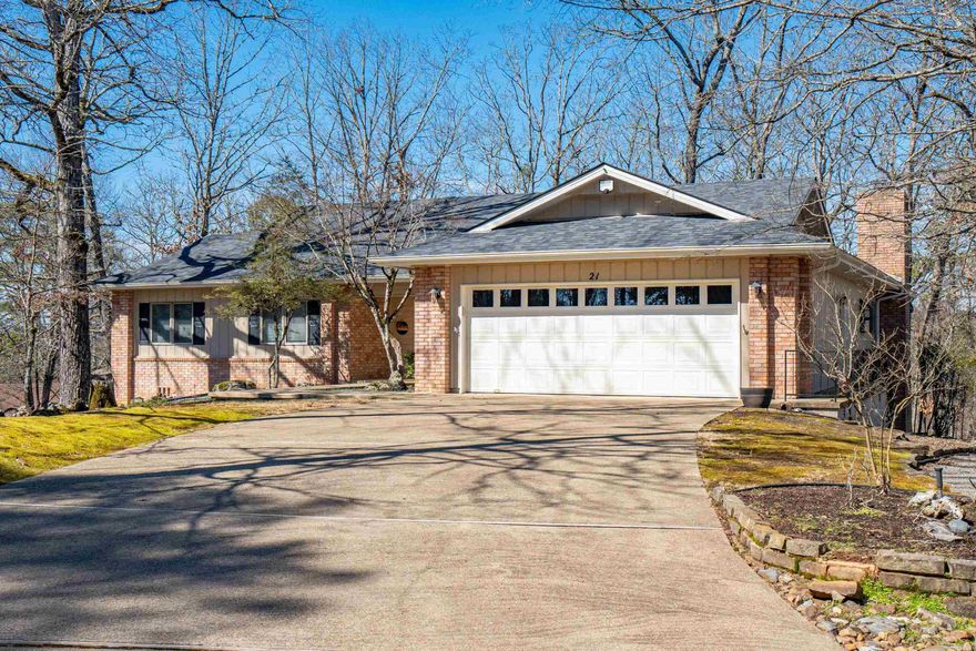TREMENDOUS DRIVE UP APPEAL & PRICED JUST RIGHT! Peeks of Lake Cortez across the street. Very private 3 bedroom, 2 bath open floor plan & lots of natural light in this home, vault living room, handsome all brick gas log fireplace hearth & mantle flanked with built in shelving. Well designed kitchen with wall oven & microwave, plenty of cabinets and inviting breakfast bar...don't miss the delightful window box over the sink, perfect for growing herbs. Primary suite has 4 huge closets, SPECIAL SUNROOM/OFFICE/OR SITTING AREA adjoins this bedroom & private exit to the deck. Part of deck is screened. Extra landscaping includes a pond, flagstone paved patio off the deck + darling "she shed" that matches the home. BONUS: WORKSHOP!!! Window unit, sheet rocked.  Or just fantastic storage!