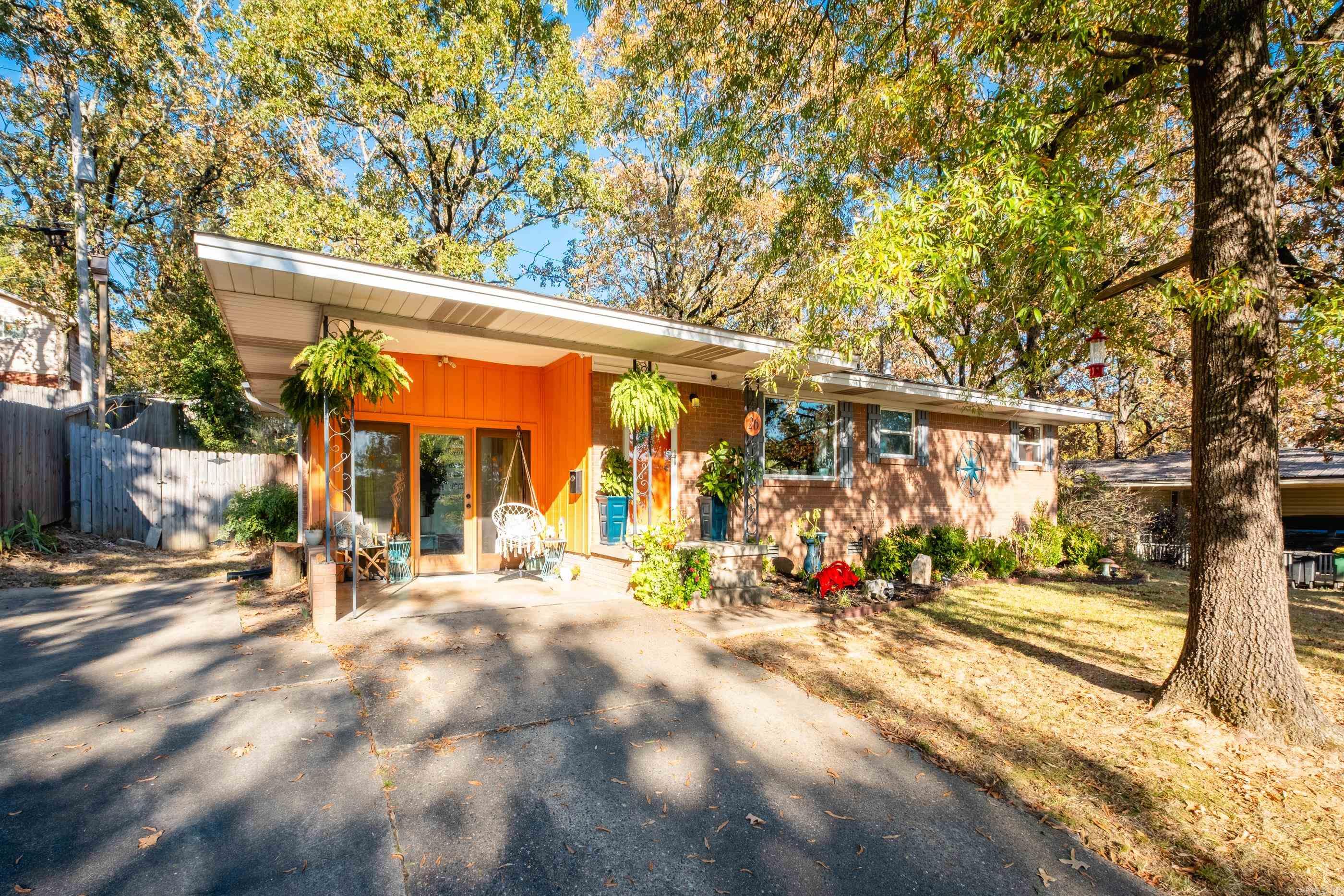 A mid-century modern charmer that has original hardwood floors. A sun room was added and is the perfect spot to relax after work. Includes a backyard oasis for entertaining and privacy. New energy efficient windows showcase a view of the city skyline with a panoramic view of the state capitol. There are many fantastic and hidden treasures with some of the original lighting and historically accurate features that have been updated and modernized to create a retreat in the city just minutes from everywhere. This home can be used as a 2 or 3 bedroom home with countless outdoor areas to relax and unwind. Agents please see remarks.