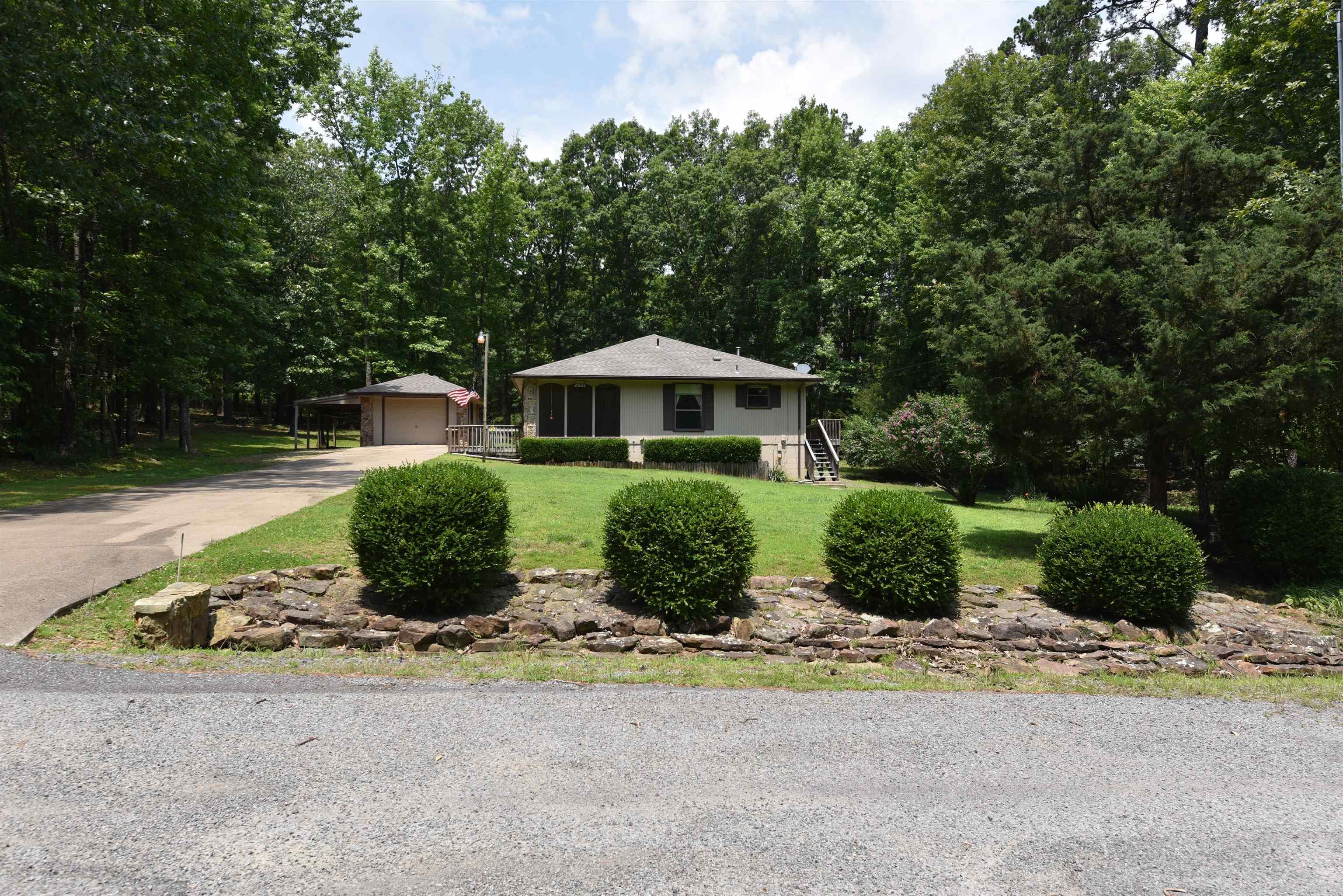 SECLUSION AND PRIVACY! If you are searching for a home that offers ultimate seclusion, privacy, and abundant wildlife, look no further! This charming and well-maintained house is situated on two lots and is currently the only home on the street. Wildlife enthusiasts will appreciate the frequent visits from deer, turkeys, birds, squirrels, and more. The home features two bedrooms and two full bathrooms, as well as a beautiful wood-burning fireplace that will keep you warm and cozy during the winter months. There is also a detached garage with an additional lean-to, perfect for storing your fishing boat or ATV. Enjoy the outdoors from the lovely wood deck, and take advantage of the ample storage space available. The roof is only one year old! Donāt miss the opportunity to see this charming home and its wonderful locationācall today to schedule a showing!