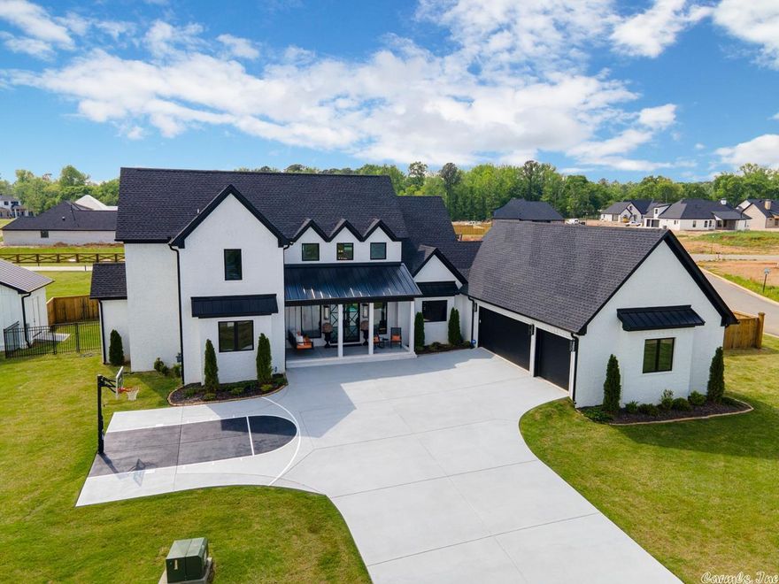 Stunning,custom built home with a view of Hurricane Lake offers 4 bedrooms and 3 baths, office, additional enclosed patio, custom kitchen with huge island and SS appliances,oversized pantry and so much more. Every detail of this home is elaborate including the lighting,plumbing fixtures,flooring and custom black blinds.  The master bedroom is huge with the most amazing en suite.Garage has a power lift into the attic. She shed with heat/air,overhead door and double doors with ramp! This home is a must see!!