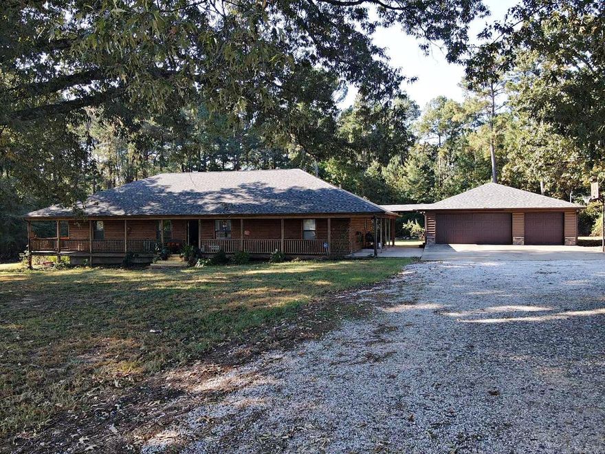 Charming 3BR/2BA home on 3 beautiful acres in Bismarck! Spacious open-concept layout with living, dining, and kitchen flowing seamlessly--plus a bright sunroom and upstairs bonus room perfect for an office, playroom, or guest space. Enjoy outdoor living with a full wrap-around porch and an above-ground pool with deck for relaxing or entertaining. Detached 2-car garage plus an additional garage/workshop--fully insulated with water connection--offers incredible space for hobbies, storage, or home business. Log-style exterior adds rustic curb appeal, while modern amenities like central HVAC and updated finishes provide comfort and functionality. Located in a peaceful rural setting just minutes from town, schools, and nearby lakes. Plenty of room to garden, expand, or simply enjoy the quiet countryside. This unique property blends charm, space, and utility--don't miss it!