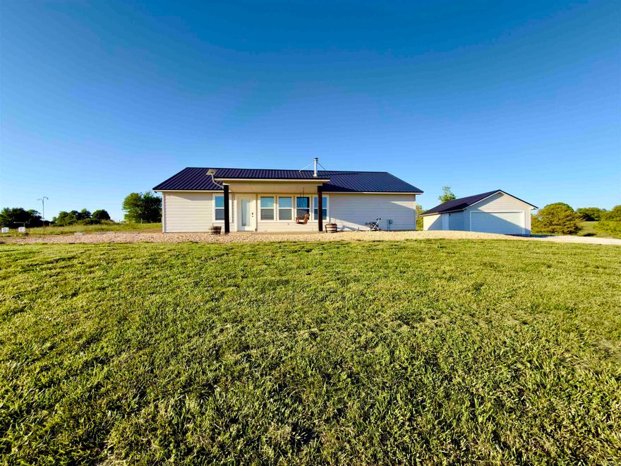 Discover this modestly furnished 3-bedroom, 2-bathroom home, built newer and efficiently designed for comfortable, affordable living. Enjoymodern upgrades including beautiful granite countertops in the kitchen and a cozy wood/coal hybrid stove for reliable backup heat—perfect forthose crisp evenings. The standout feature? A loaded garage/workshop packed with everything you need to maintain a true homestead—tools,equipment, and space for all your projects. Step outside to your own mini orchard with peach, apple, and pear trees just waiting to provide freshfruit for your family. Bring your horses (or any livestock!) and embrace the quiet, self-sufficient country lifestyle you've been dreaming of. There'seven a separate garage for all your toys, vehicles, and equipment. All appliances, washer, dryer and tractor convey! Surrounded by the naturalbeauty of the Buffalo River area—perfect for hiking, hunting, canoeing, and outdoor adventures.