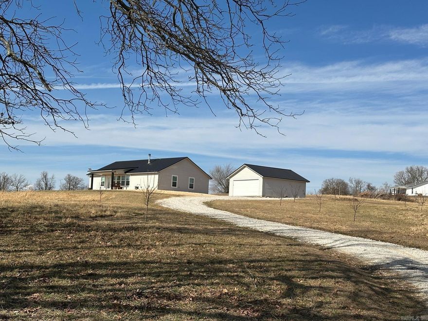 Discover this modestly furnished 3-bedroom, 2-bathroom home, built newer and efficiently designed for comfortable, affordable living. Enjoymodern upgrades including beautiful granite countertops in the kitchen and a cozy wood/coal hybrid stove for reliable backup heat—perfect forthose crisp evenings. The standout feature? A loaded garage/workshop packed with everything you need to maintain a true homestead—tools,equipment, and space for all your projects. Step outside to your own mini orchard with peach, apple, and pear trees just waiting to provide freshfruit for your family. Bring your horses (or any livestock!) and embrace the quiet, self-sufficient country lifestyle you've been dreaming of. There'seven a separate garage for all your toys, vehicles, and equipment. All appliances, washer, dryer and tractor convey! Surrounded by the naturalbeauty of the Buffalo River area—perfect for hiking, hunting, canoeing, and outdoor adventures.