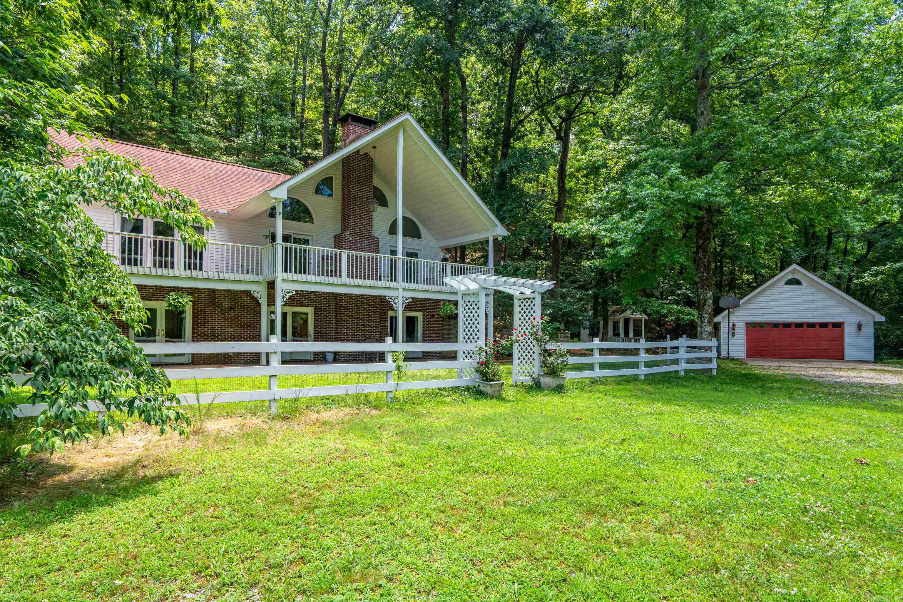 Welcome to your dreamy country retreat! Nestled on 12 beautiful acres (3 lots), this private oasis offers the perfect blend of comfort, charm, and functionality. The property features a spacious home surrounded by mature trees and open pasture, ideal for enjoying peaceful country living. A well-equipped barn with 4 horse stalls, a chicken coop, and a greenhouse making it perfect for those wanting to embrace a self-sustaining lifestyle or hobby farming. Cool of on hot summer days in the sparkling above ground pool, or unwind on the patio overlooking the serene, natural landscape. Whether you're looking for a homestead, a horse property, or simply room to roam, this property delivers with space, versatility, and stunning views. Enjoy the best of rural life while still being conveniently located to nearby amenities. Don't miss this rare opportunity to own your own slice of paradise! Natural Springs features a private lake for fishing and enjoyment! As a bonus, this home is located just minutes to Hot Springs or Hot Springs Village! Ask about access to 11 Lakes, 9 Golf Courses, 30 miles of walking trails, pickle ball, tennis, fishing, and so much more!
