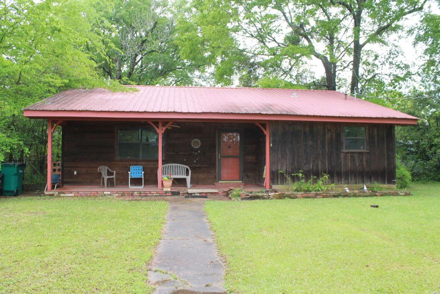 Extra large lot; 2 storage buildings; small fenced in area for a dog