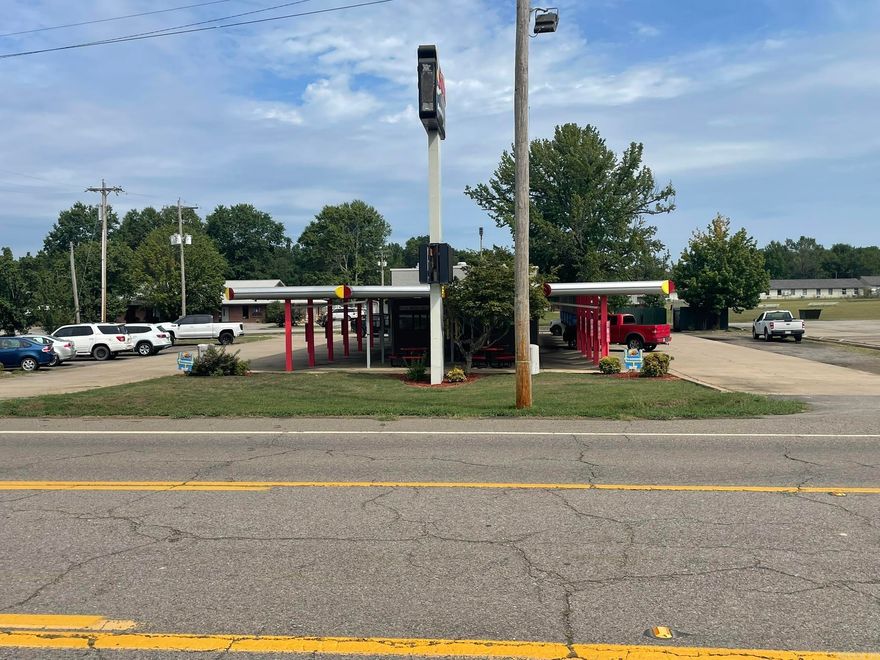 Prime commercial investment opportunity in Danville! This property currently operates as a Sonic Drive-In and will remain open until sold. The sale includes the real estate and improvements only — Sonic franchise, business name, and equipment do not convey. Featuring a well-maintained drive-in style building with canopy-covered parking stalls, walk-up service windows, and great visibility on East 8th Street. High-traffic location with easy access to Hwy 10 and surrounded by established businesses. Whether you’re looking for a turnkey site for your next restaurant concept or a solid long-term investment property, this location offers strong exposure, proven use, and valuable commercial potential in a growing Arkansas community.