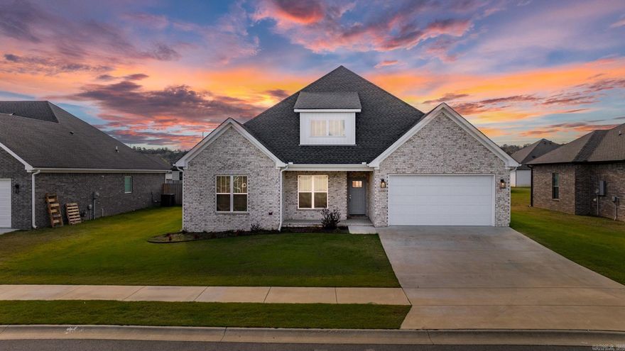 Discover the pinnacle of elegance in this stunning home featuring 4 bedrooms and a spacious upstairs bonus room, spanning 2,367 square feet, nestled within the serene Ivy Place subdivision. The kitchen is a chef's dream, boasting a gas stove, pristine white cabinets, stainless steel appliances, and a central island complete with a built-in sink, perfectly accommodating all your culinary adventures. The open and split floor plan promotes a seamless flow between the kitchen and dining areas, making it ideal for both everyday living and entertaining. The primary suite offers a luxurious retreat, featuring a custom shower, dual sinks, a relaxing garden tub, and a large walk-in closet providing ample storage. Enjoy cozy evenings by the gas fireplace or retreat to the covered back porch for a breath of fresh air. The additional concrete patio is perfect for outdoor gatherings, while the fully fenced backyard, enclosed by a wood privacy fence, ensures comfort and seclusion.