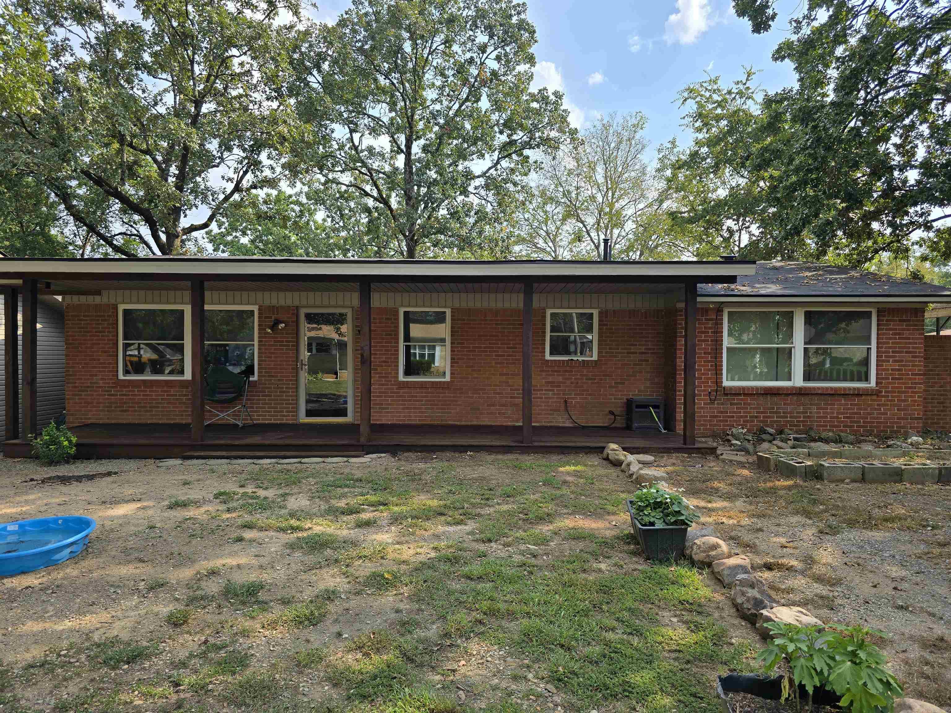 This Charming home near Lake Hamilton, has New Windows, New Elecreical, Water heater is 2023, Roof 2024. The Carport has been converted to a Primary Suite with a large Walk-in Shower with 2 Shower heads. The Kitchen has a hidden microwave above the In-wall stove. New stove top in 2021. This home sits on an odd lot with a storage shed in the back. Measuring encouraged.