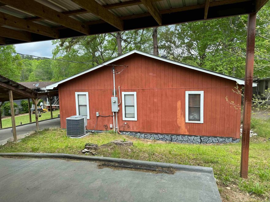 Investor? Handyman? This one is perfect for you! Home sits right on the edge of Lake Catherine and with a little work could be a great lake getaway! Remodel has already been started and just needs to be finished. 3 bedroom 2 bath with large eat in kitchen and 3 sliding glass doors overlooking lake. Large deck on back of home with tiered stairs to boat dock. 3 car carport and covered walkway leading to house. Offer is subject to probate court approval.