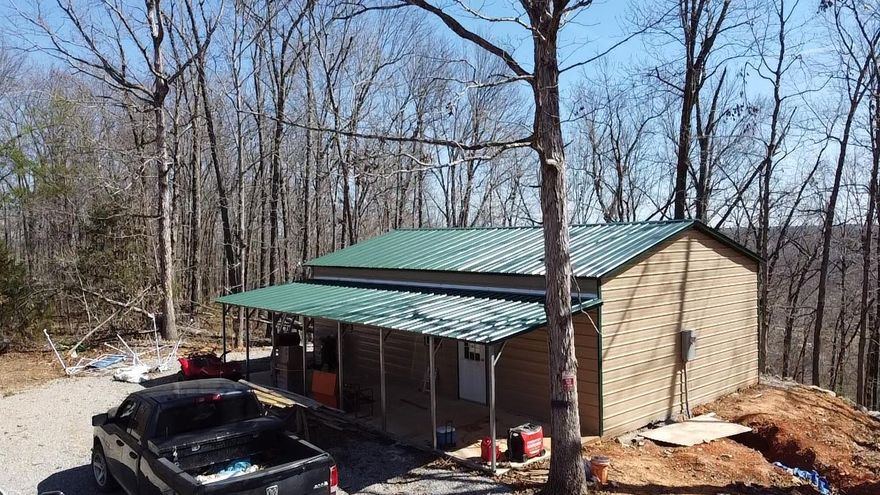 Beautiful 9.9 +/- acres overlooking the Spring River in Hardy, Arkansas. Property features a newly constructed 24x30 metal barndominium built in 2025 on a concrete slab. Structure is insulated and includes a mini split system. Utilities in place include electricity, city water and a new septic system. Interior is unfinished, offering an open canvas for customization to suit a primary residence, vacation retreat, or investment property. Gently elevated setting provides scenic river views and added privacy. Great opportunity to complete construction to your specifications in a desirable area near Spring River access, recreation, and the amenities of Hardy.