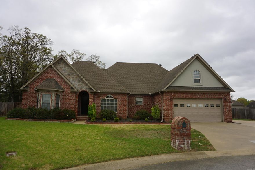 Beautiful 4/2 brick home in West Searcy at the back of the subdivision that backs up to the woods. Has a huge fenced in back yard and a good size wired shop.  The kitchen living room and dining room are all very open and there are 9' and 10' ceilings plus lots of windows for such a spacious and inviting feeling. There are tons of cabinets and so much countertop space in the kitchen with pretty travertine flooring. The large laundry room has cabinets for storage and there are several storage closets in this home. The primary bathroom has a new tile walk in shower plus a soaking tub and his/her walk in closets. The huge covered back porch is so ideal for relaxing and watching the kids and dogs play in the back yard. Just such a pretty home and is in a perfect location