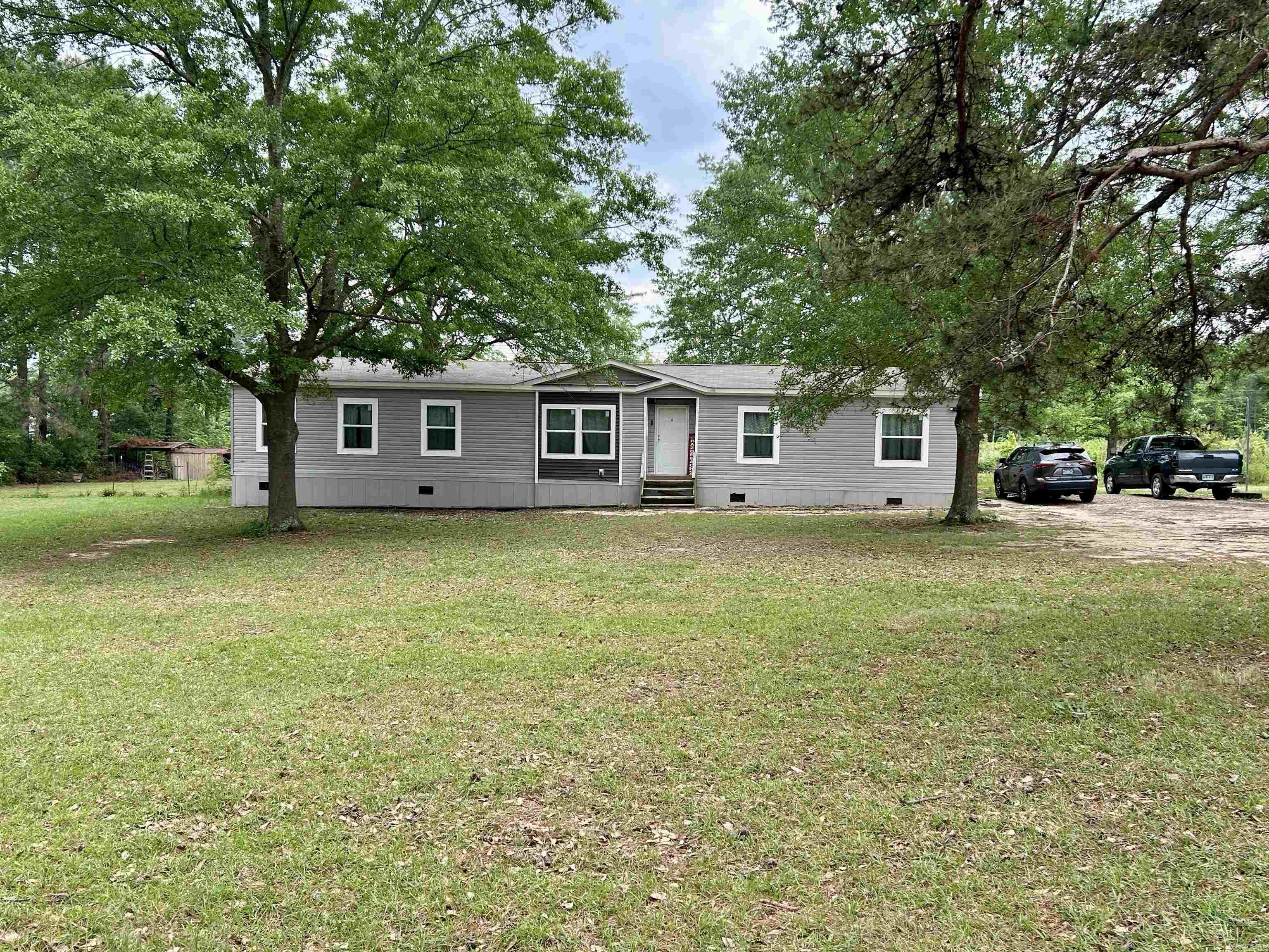 *Back on the due to buyer financing* Come and see this large established lot which already has a second power/gas service set up for a new shop or another home for family or possible rental income. *Brand new dishwasher and water heater. This home features 4 bedrooms, 2 full bathrooms, and a large, open-concept layout perfect for families. The Primary bedroom is very spacious and offers additional space for an office/study or nursery. The primary bathroom has a large walk-in shower and full size soaking bathtub. This beautiful kitchen features expansive cabinet and countertop space. Next to the kitchen is your large living area for your family. There is a separate laundry room also. On the opposite side of the home you have three spacious bedrooms and a full bathroom. Transferable manufacture home warranty remaining until 8/19/2026 included. Plant a large garden or just sit back and enjoy your beautiful two acres. ***The property does have two separate address. 10225 and 10235.*** New Survey!