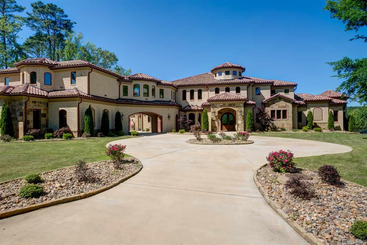 This stunning home sits on an acre on the water with breathtaking views Amenities include gourmet kitchen,theatre room with bar area,retractable doors,infinity pool, outdoor kitchen,large fireplace,fire pit,sea wall, boat dock. solid wood 8'stained doors, Full home automation package,geothermal heating and cooling, heated floors,Sauna,workout room, steam shower, stucco finish over brick,in-law quart. elevator shaft, bball court,foam insulation,office with half bath,too many amenities to list!