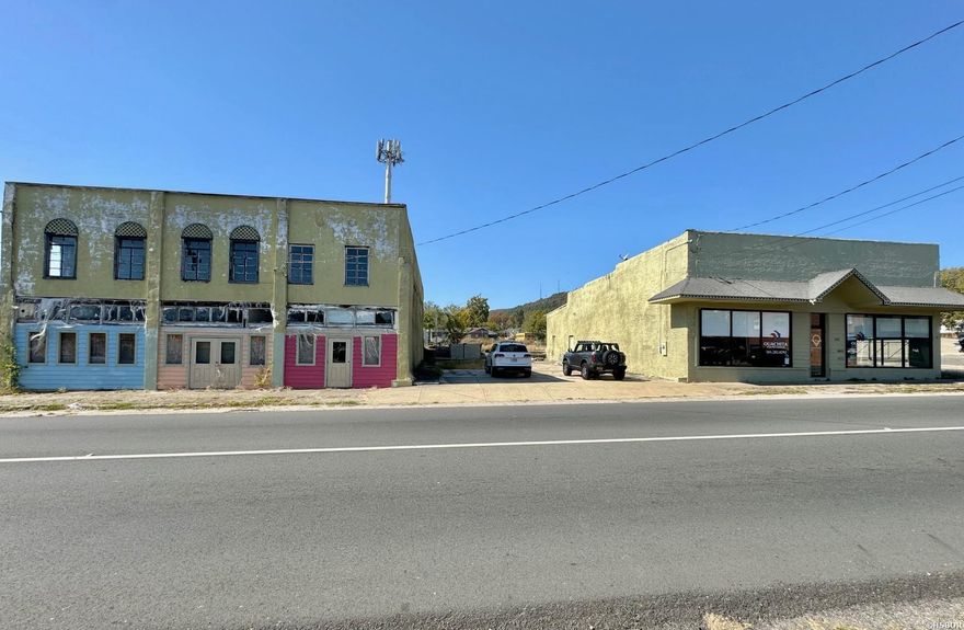 Fantastic price on these two commercial buildings in Hot Springs, located in a high traffic area near downtown Hot Springs.  Zoned C-2 commercial.   The office building is approx. 3500 sq. ft. and was renovated a few years ago - move in ready.  The office building also has a shop area in the back.   The adjacent two story building is structurally sound but needs a full renovation.   Lots of possibilities with that building!  All combined, it's over 11,000 sq. ft. of space.   The buildings share a parking lot between them.