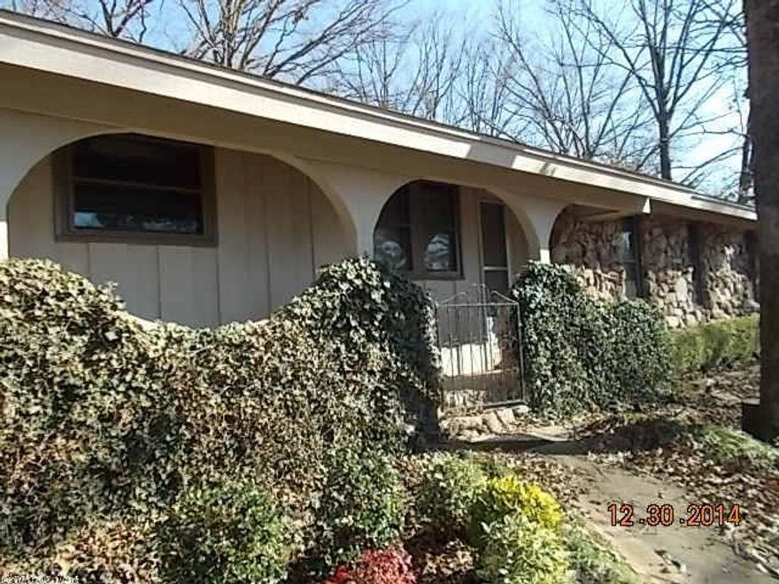 How about them bones!  Fantastic Indianhead Lake Estate home with good bones and outstanding possibilities, lots of character and charm from the rock and frame fireplace to a folksy kitchen and dining area.  One of bedrooms is making a great little office right now and ready for conversion to whatever and updated windows are good.  Huge yard with beautifully mature oaks .  Enjoy the storage benefits or workshop uses of a 20x40 building with slab floor, electric and OH garage door.  See agent remarks.
