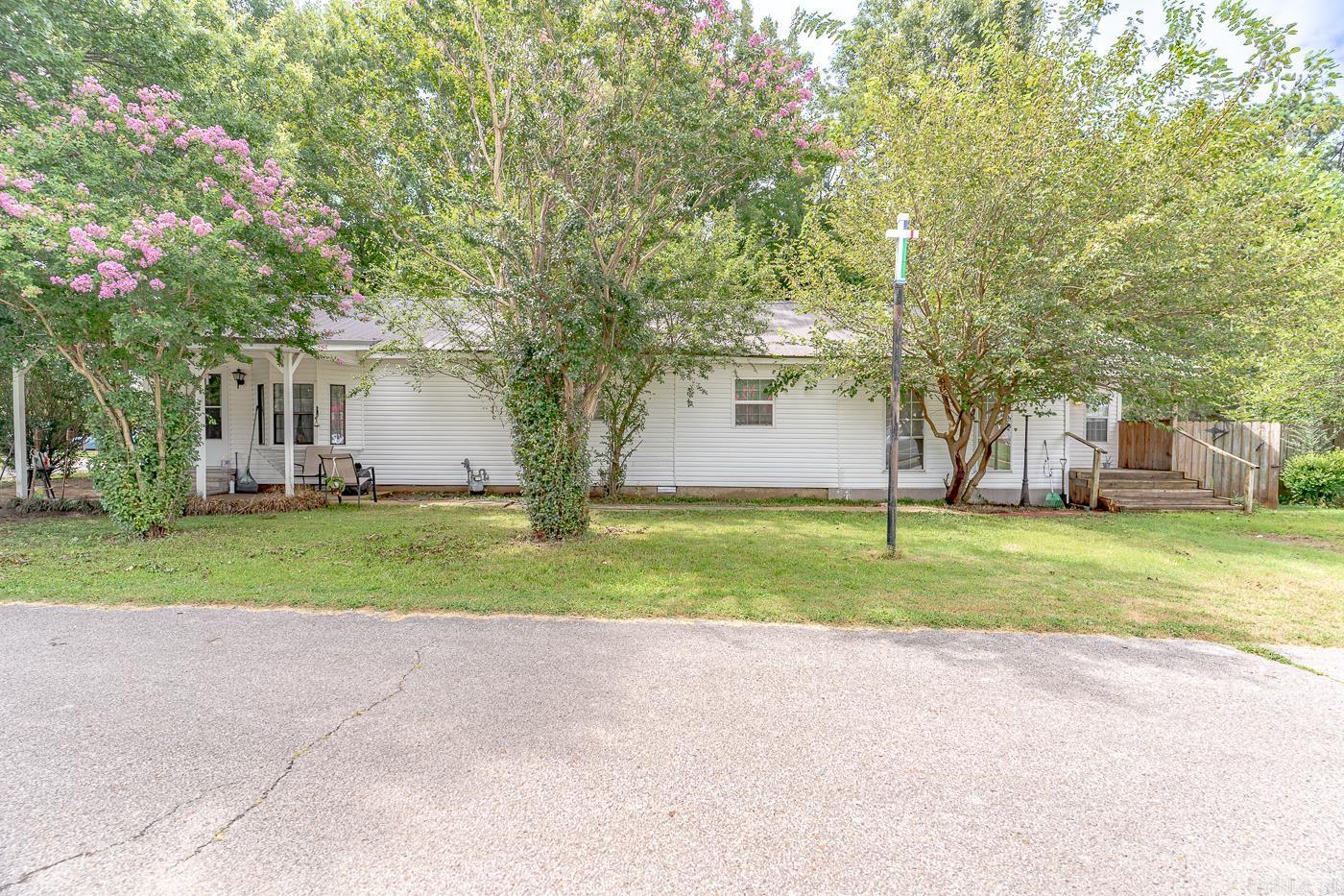 Welcome to Market 601 Tupelo St. in Lake City, AR! Discover this beautifully maintained and updated home that perfectly blends timeless character with modern upgrades. Boasting generous living space throughout. This home features a large living room anchored by a beautiful gas fireplace! There is a spacious eat-in kitchen with breakfast bar, plenty of counter space, and a walk-in pantry. The property has 3 large bedrooms and 2 bathrooms. Both of the bathrooms have been completely updated!! The primary bathroom has been updated with new closets, new barn doors, new sink, and new shower/bathtub combo. The guest bathroom features a new sink and new walk in shower! In 2020, the metal roof was installed, new gas lines, new HVAC, ductwork and vents. The backyard features a wood privacy fence and patio. Do not miss your chance to see this property!! Call today to schedule your tour!!