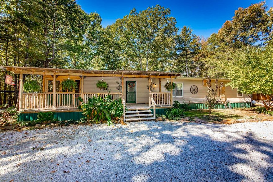 Escape to your own private oasis with this beautifully updated 3-bedroom, 2-bathroom mobile home, attached with hurricane ties, perfectly nestled on 9.2 breathtaking, wooded acres. Located just minutes from the lake, this property offers the ultimate blend of peaceful seclusion and easy access to recreation. Spanning approximately 1,600 sq ft, the home features a bright, open-concept living area with newer flooring and modern updates throughout. Heat is provided by propane wall heaters. The comfortable layout includes three generous bedrooms and two full bathrooms, providing ample space for family, guests, or a home office. Step outside to enjoy a large screened porch and expansive decks, perfect for relaxing or entertaining while soaking in the serene natural views. The 9.2-acre property is a nature lover's paradise, offering ultimate privacy, mature woods, private walking trails, and even a seasonal creek. Whether you're looking for a private homestead, a weekend escape, or a vacation retreat, this move-in-ready home is a rare opportunity. Don't miss this chance to own a slice of country paradise with substantial acreage in a prime lake-area location. Schedule your showing today!