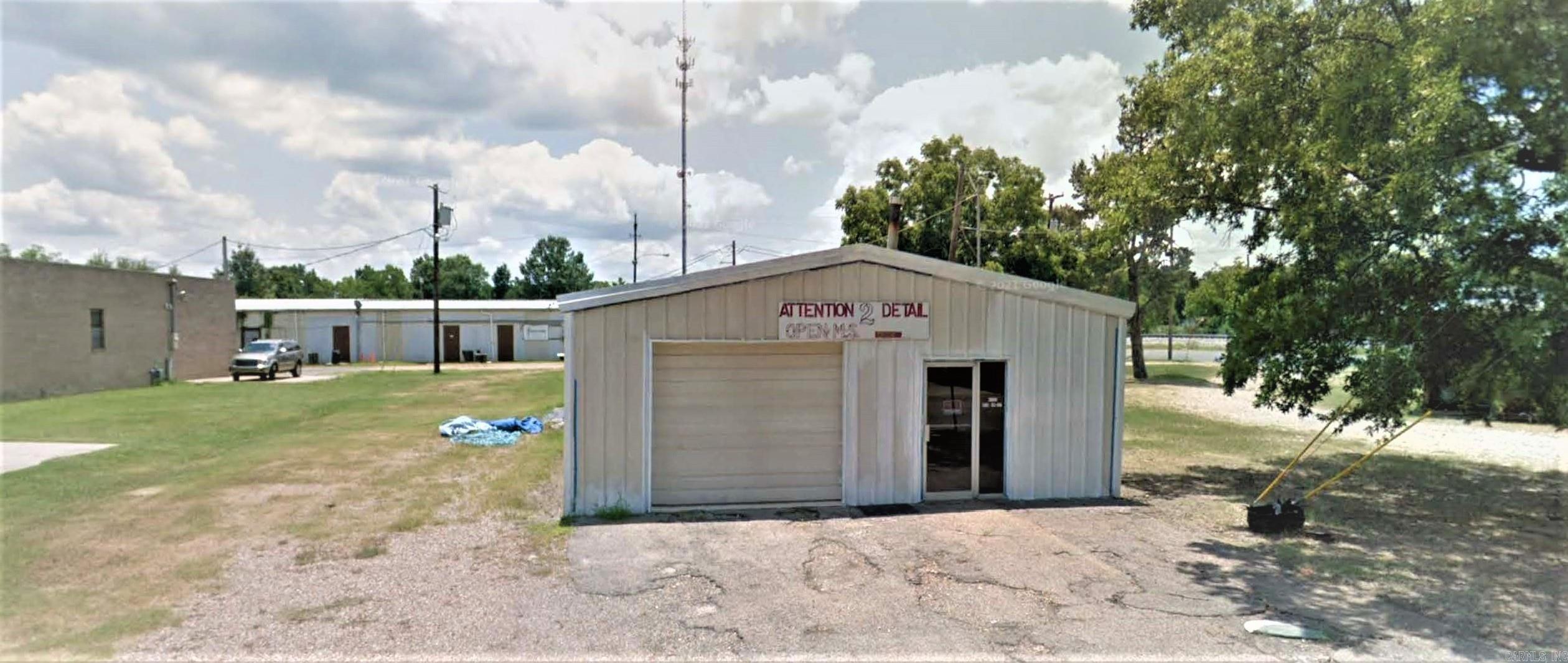 Commercial property for sale! 120 x 30’ Shop Building on a Concrete Slab with Roll Up Doors on the Front, Side and Rear. 20 - 8 Ft Led Lights have been Installed by Licensed Electrician. The Shop has 3 Phase Electric with a New Panel along with the Standard Electric for 110 & 220. Inside the Shop it has an Enclosed Booth, a Bathroom and an Office.