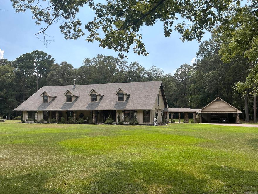 Beautiful Cypress home offers approximately 3,200 square feet of living space. Cypress wood/stone featured throughout interior/exterior, complemented by 40 ambient can lighting both inside/out.The spacious living room includes wood-burning gas fireplace, brick seating, recently updated with stone accents matching 27 stone columns/walls throughout home .The formal dining area is open to the formal living room. Decorative concrete flooring flows seamlessly through the interior and out to the back patio, unifying spaces. The kitchen features new Café appliances, granite countertops/decorative tile backsplash, textured faux-finish walls, pantry, and breakfast area, access to laundry room/half bath. Master suite includes walk-in closet, carpeted flooring, master bath with double vanities. Two additional bedrooms. Two full bathrooms are located on the opposite side of the home with bedrooms. Large den with Cypress walls & decorative concrete flooring, can serve as a fourth bedroom. 3 Glass doors lead to a spacious covered patio. Other features include 2 hot water heaters, new HVAC, insulated  windows,1,600 sq ft floored attic, roof 2018. For more info see Brochure displayed at the home.