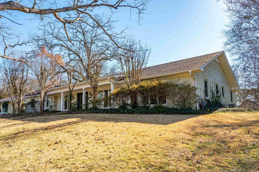 Welcome to 112 Parkridge Street, a spacious and beautifully maintained home offering approximately 3,250 sq ft of living space. This property features 3 bedrooms, 3 full bathrooms, and a convenient carport, providing both comfort and functionality. The home showcases a large remodeled kitchen designed for entertaining, complete with an island, cook top, double ovens, ice maker, dishwasher, and an oversized pantry. Interior highlights include hardwood floors, a wet bar, sauna, and extensive storage throughout. Enjoy outdoor living in a private, park-like setting with mature trees and lush landscaping. The backyard features a covered patio with pergola, exterior sound system, screened in patio, and an in-ground swimming pool, perfect for relaxing or hosting guests. Located just minutes from shopping, dining, medical facilities, and all that Hot Springs has to offer, this home combines space, amenities, and location. Schedule your private tour today.