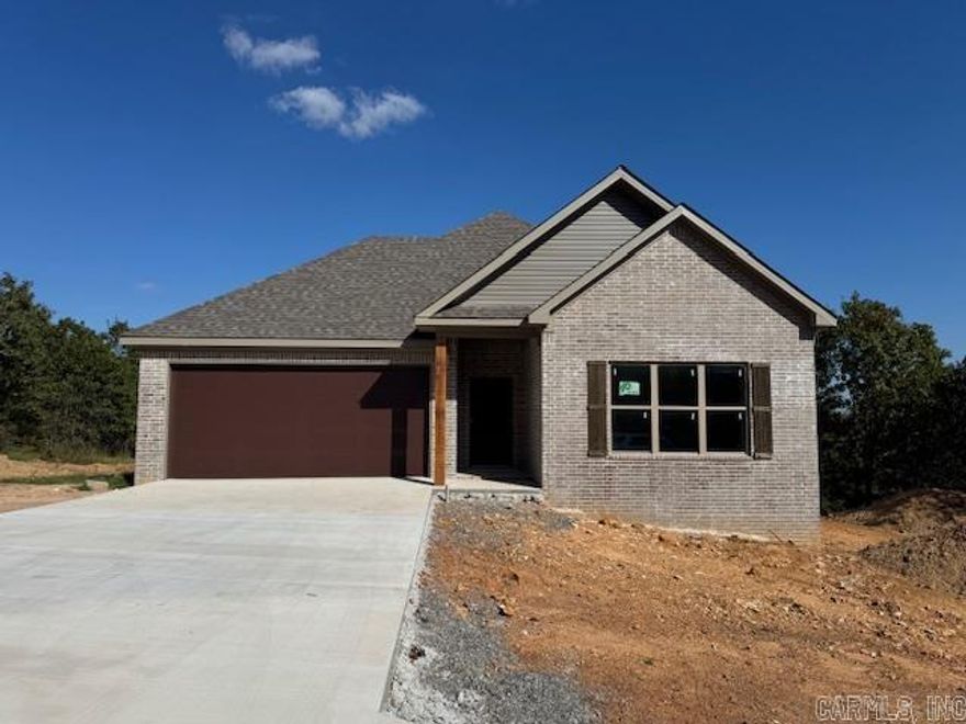 Looking for a new home on a large lot. This is it! Enjoy the view from your back porch. You will likely see a few deer. Large living room open to the kitchen. Pantry in the kitchen.  Nice sized island in the kitchen with cabinetry in the island. Electric fireplace. Lots of windows make the home bright and airy. Guest rooms are separate from the primary bedroom. Tile showers in bathrooms. Has a nice yard with trees. The backyard is private with woods behind the home.