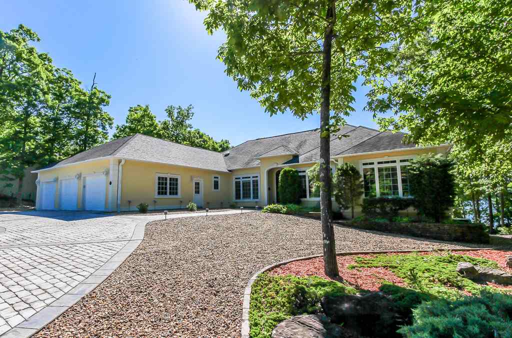Stunning Lake Balboa home with spectacular view and 106' of lighted seawall. 4 Bdrms with possibile 5th, 4 1/2 Bas, High Vol. Ceilings, Upper level offers gourmet kitchen w/island granite counters, 2 Bdrms, Library/Office, 2 full and 1/2 ba, Family Rm, 2 Screen Porches. Lower level offers: Fully equipped kit, bar, 2 Bdrms, Exercise or bonus rm, 2 Full Bas.Stg. Rm, Mech. Room, Workshop. Additional features: 3 Car Gar., Crown Molding, Plantation Shutters, Cobblestone Drive, Crown Molding, Prof. Landscaped