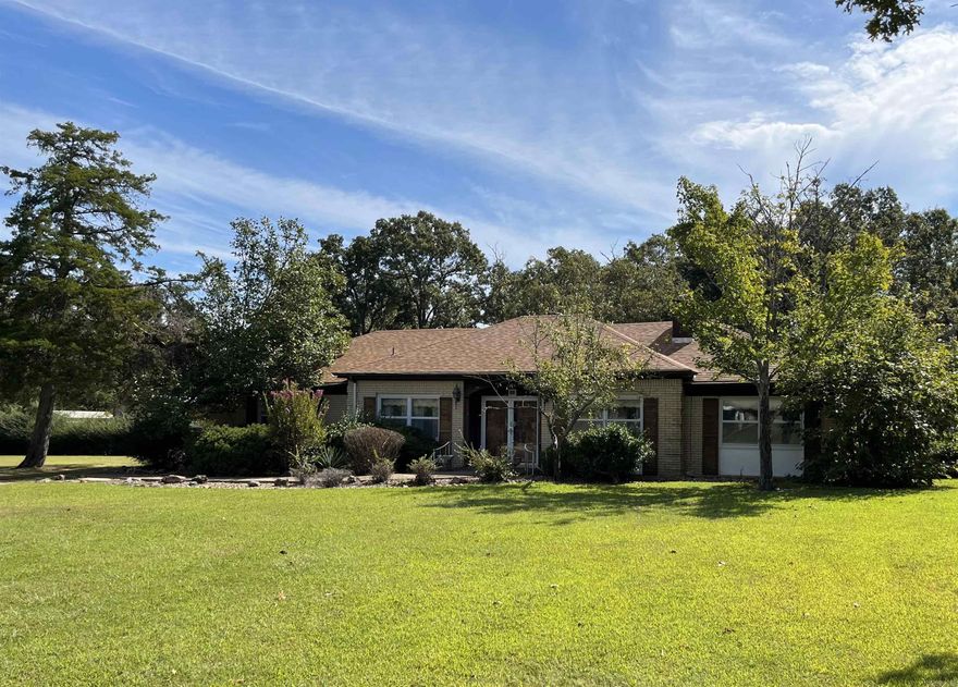 Great home close to town! 3 beds 2 full baths. Double door entry to large living room with wood insert fireplace. Formal Dining Room. Large primary bedroom with en-suite bath and walk-in closet. Eat-in Kitchen, Sunroom and attached 2 car garage. Additional 2 car garage for parking or workshop. Parque flooring in two bedrooms. Roof is 2 years old, HVAC is 2 years old. One bathroom has been updated. Home needs some love, but this property has so much potential! Level lot, quiet subdivision, close to town, stores, and hospital with No Restrictions! Additional parcel# 002-10252-000