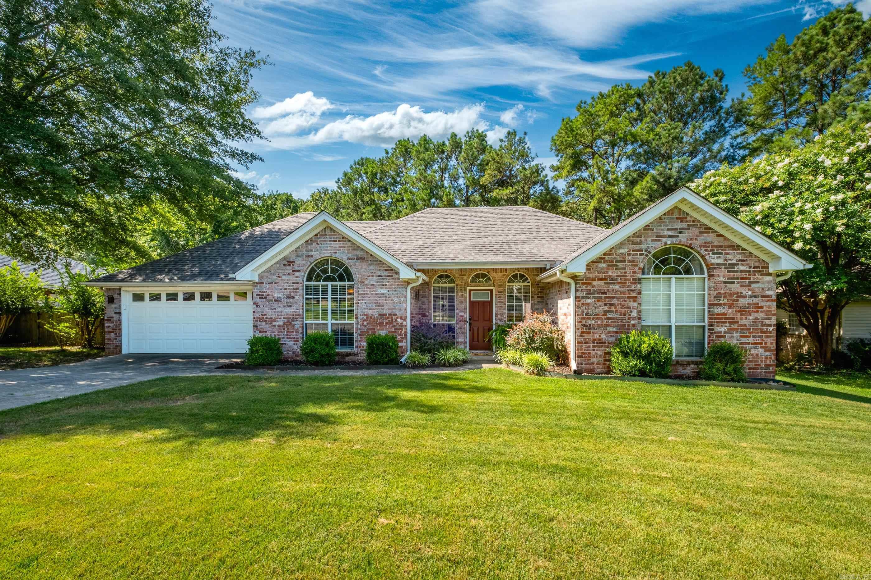 Darling all brick, one story with private back surrounded by green space! Luxury vinyl floors that have the look of real wood throughout the living space! Kitchen and baths have neutral tile. Great room has tall tray ceilings and wood burning fireplace. Step off the entry to the Formal Dining room with tall cathedral ceiling or this space could be an office/playroom. Kitchen has breakfast bar, beautiful stainless LG Refrigerator & dishwasher, ceramic top stove and casual dining area open to the great room. Primary suite has tray ceilings, beautifully remodeled shower and extra large closet, all is separate from the other bedrooms. Step out back to enjoy a nice deck and fully fenced yard. No neighbors directly behind the house, only green space. New Roof 2024, Hot water tank 2023.