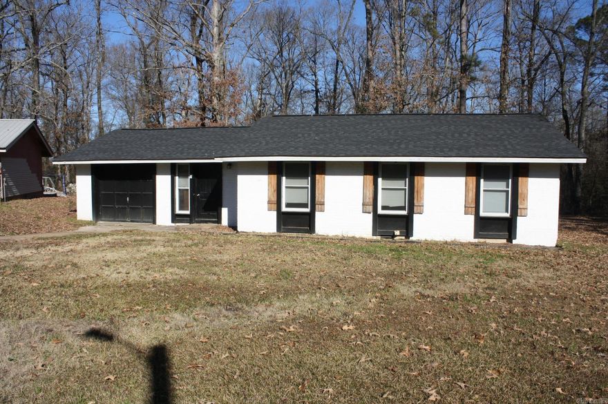 3 Bedroom, 1.5 Bath, approx. 1110 Sq. Ft. of living space situated on 2 lots.  Central AC/Heat.  Wood patio.  New roof.