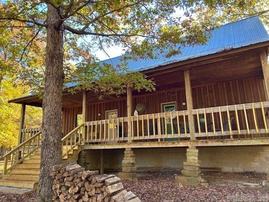 Escape to the Ozarks with this charming 3-bedroom, 1-bath cabin—featuring one large bedroom that could easily be converted into two bedrooms. Nestled on 23 park-like acres, this private retreat offers a rare blend of natural beauty and seclusion at the end of a private road, with beautiful mountain views. Complete with a barn, chicken house, garden, creek, and a natural year-round spring, this property would make an excellent home for a growing family or a peaceful private getaway. The land is fenced for animals such as sheep and goats and is already an active Airbnb (Fox Mountain Lodge). It is adjacent to managed timberland, providing added privacy and endless opportunities for outdoor recreation. There is an abundance of wildlife, including turkey and deer—enjoy watching them pass by from the comfort of your porch. Located in the friendly small town of Fox, Arkansas, near the Little Red River and just minutes from Mountain View—known as “The Folk Music Capital of the World.” The beautiful White and Buffalo Rivers are also only a short drive away. Whether you are looking for a personal getaway or a forever home, this property could be the perfect fit. Shown by appointment only.