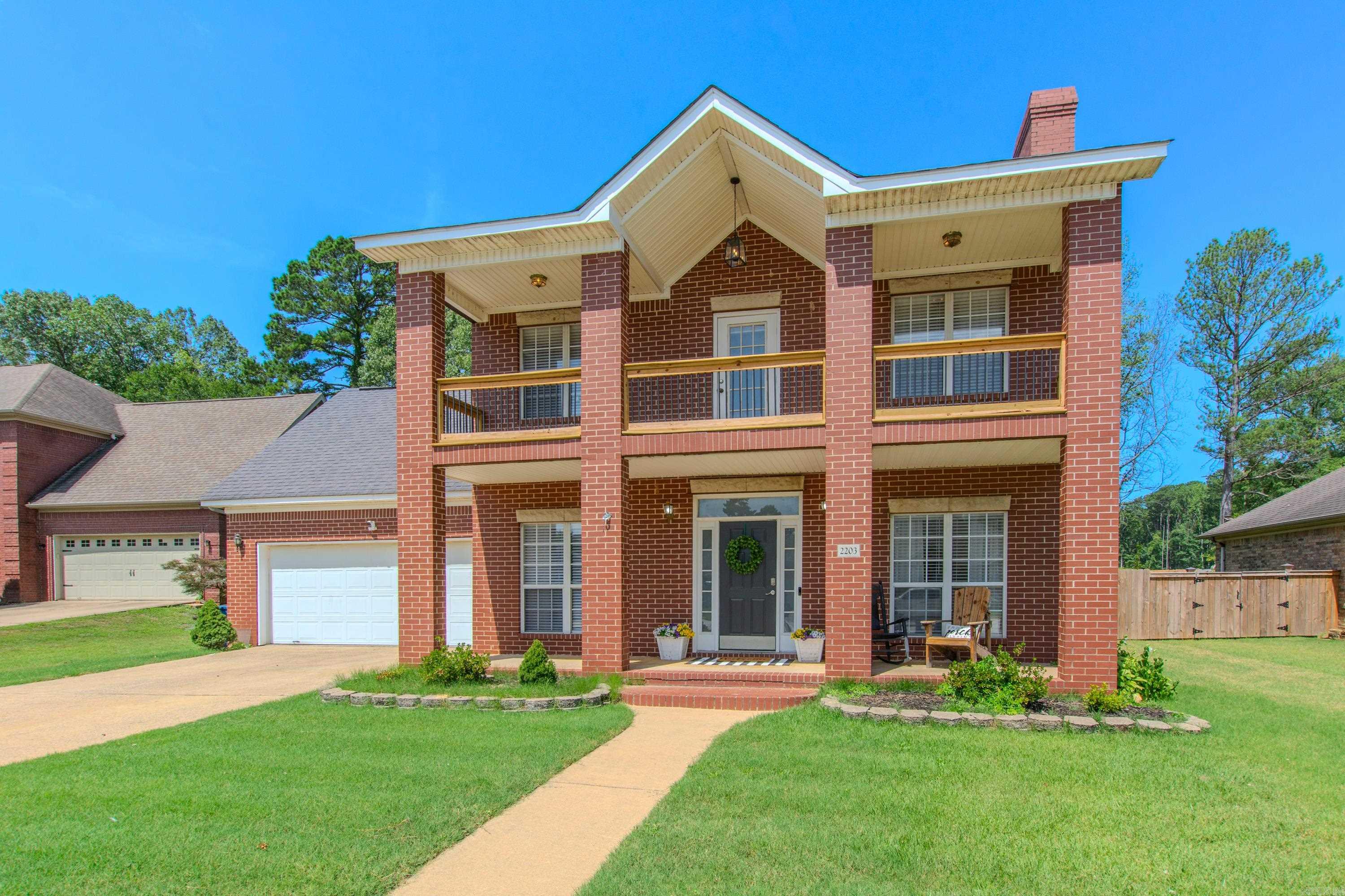 Charming all-brick home in an established neighborhood featuring a welcoming front porch and upstairs balcony. The main level offers a cozy living room with a brick fireplace, a kitchen/dining combo with stainless appliances, and a versatile flex space perfect for a formal dining room, office, or additional sitting area. Upstairs includes 3 bedrooms, 2 full baths, and a BONUS room ideal for play or work. A unique catwalk connects the primary suite to a secondary bedroom and provides access to the upstairs balcony. Enjoy neutral paint tones, updated flooring downstairs, and ample natural light throughout. Seller offering $5,000 buyer credit. See agent remarks.