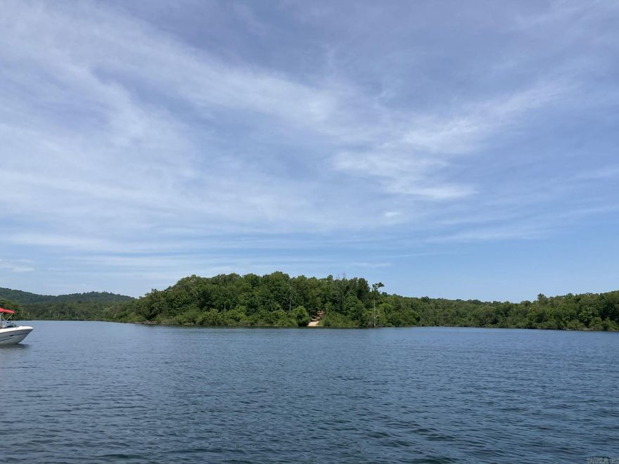 Construct your lakeside residence on this stunning 6.25 AC M/L parcel, which is bordered by United States Army Corps of Engineers land. The terrain gradually descends to the lake at the road's conclusion, offering a secluded and private setting with no restrictions. Experience tranquility near Bull Shoals Lake, complemented by a rich variety of wildlife. A well and septic tank will be necessary, and the property has successfully passed a PERC test in the past. 6.25 AC M/L for $80,000.00