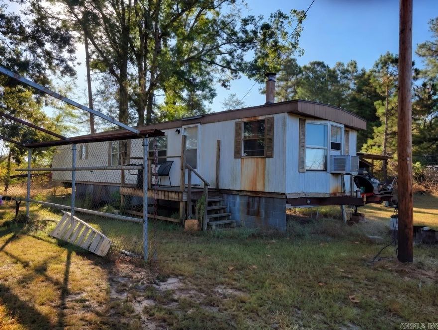 Great property in the country, trailer needs work, property has a shop.  Land has water and electric.