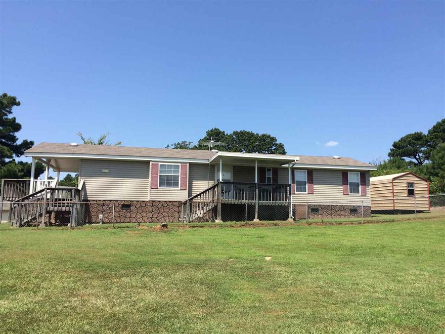 Mrs. Clean lives here! 2BR/ 2 Bath, 2004 double wide in Lake Hamilton School District and close to the school! Fenced in back yard with 10x16 storage building and a 12x30 covered carport.